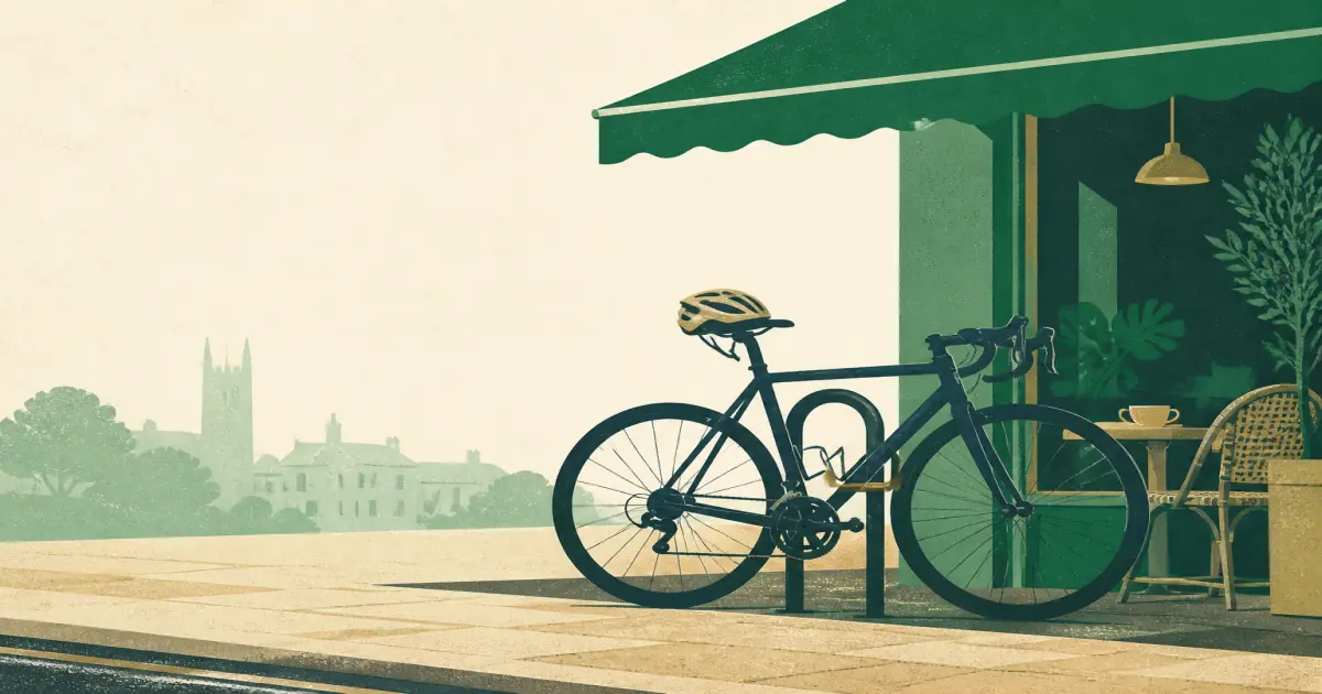 Road bike with drop handlebars locked at a city rack